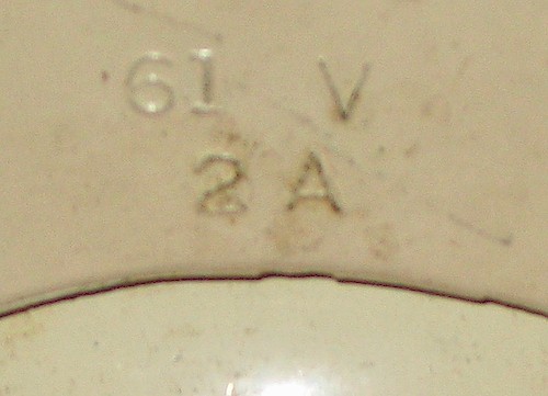 2 Cut-out 61V. Large lettering (about 2.7 mm tall). Cut-out base. 1A or 2A. 1951 to 1956. (Possibly mid-1951 to mid-1953.). Base 2, cut-out, 2A