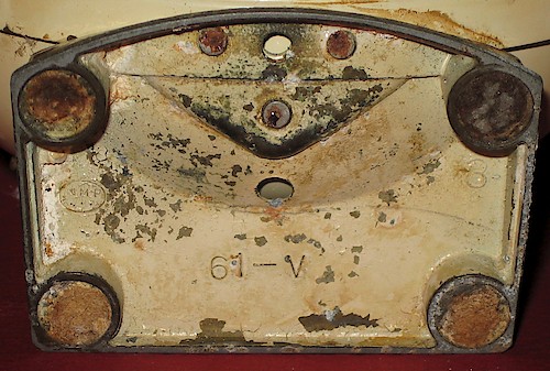 4 61-V, "NMP" in an oval to the left, base spot welded to the bezel. Cavity numbers up to 7, located at the upper right, have been seen. Used ca. 1956.. Base 4, 3