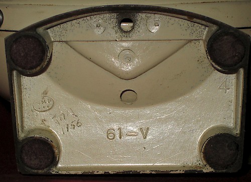 4 61-V, "NMP" in an oval to the left, base spot welded to the bezel. Cavity numbers up to 7, located at the upper right, have been seen. Used ca. 1956.. Base 4, 4
