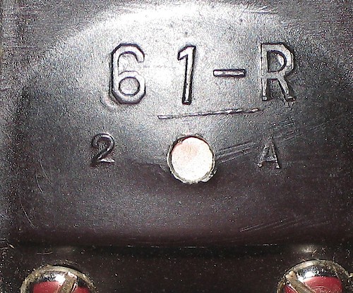 1 "61-R" in large lettering, "1 A" or "2 A" below it. Used on pre-war clocks. Clock is upright on base.. Base 1, 2 A