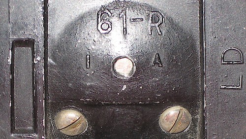 1 "LD", One Rectangle "61-R" in large lettering, "1 A" below it, "LD" at right angle on the right, recessed rectangle on left. Used ca. 1941. Clock is upright on base. ("2 A" not seen yet.). Base 1, LD,  1 Rectangle, 1 A