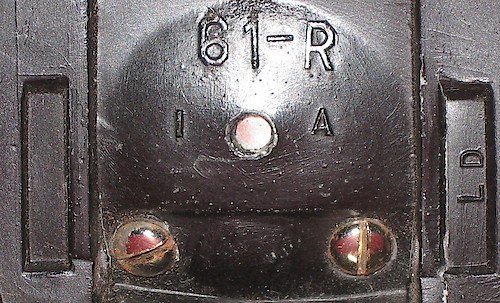 1 "LD", Two Rectangle "61-R" in large lettering, "1 A" below it, "LD" at right angle in recessed rectangle on the right, empty recessed rectangle on left. Used 1941 - 1942. Clock is upright on base. ("2 A" not seen yet.). Base 1, LD, 2 Rectangle, 1 A
