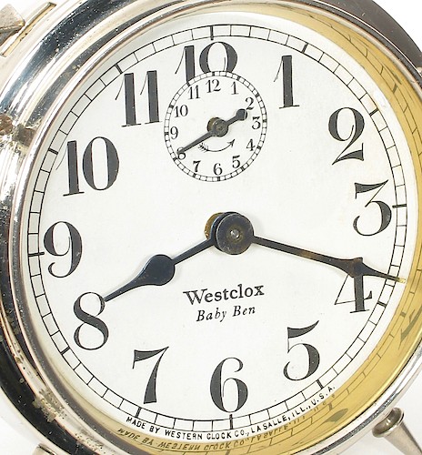 5.1 Westclox Baby Ben below center, Westclox in Roman font, flat-top x. MADE BY WESTERN CLOCK CO., LA SALLE, ILL., U.S.A. at bottom from 24.5 to 35.3 (narrow lettering). 1923 - 1925. Dial 5.1