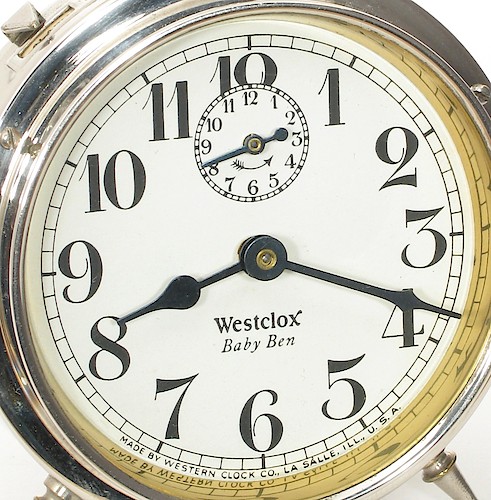 6.1 Westclox Baby Ben below center, Westclox in Roman font with TAIL on the X. MADE BY WESTERN CLOCK CO., LA SALLE, ILL., U.S.A. at bottom. Starting in 1928.. Dial 6.1. Richard Tjarks collection.