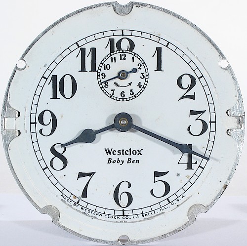 6.2 PAINTED DIAL with same lettering as 6.1. Westclox Baby Ben below center, Westclox in Roman font with TAIL on the X. MADE BY WESTERN CLOCK CO., LA SALLE, ILL., U.S.A. at bottom. Ca. 1927 to 1928. Unusual.. Dial 6.2 White