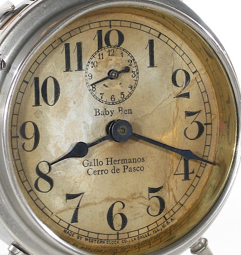 3.1 Imp Baby Ben above center with first "B" in UPPER case, dealer imprint below center, MADE BY WESTERN CLOCK CO., LA SALLE, ILL., U.S.A. at bottom. 1916 - 1917.. Dial 3.1 Imp. This example has "Gallo Hermanos, Cerro de Pasco" on the dial. Cerro de Pasco is a city in central Peru, located at the top of the Andean mountains.
