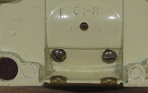 2 "Z 3 ◯ ◯" "61-R" in small lettering, "1 A" or "2 A" below it. The "1 A" base has auxiliary lettering "Z 3" on the left side, the "2 A" base has the auxiliary lettering "Z 3" on the right side. Clock tilts back on base. Two extra casting dot in base, located by the front base pads. Used from 1947 until the end of production of style 5.. Base Z3 ◯ ◯ 1A