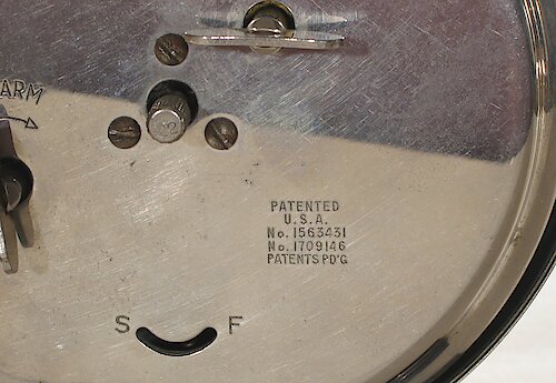 1 Two patent numbers and a sliding alarm on/off switch. Used from the start of Style 3 (1931) to ca. late 1931.. Big 3 Back 1