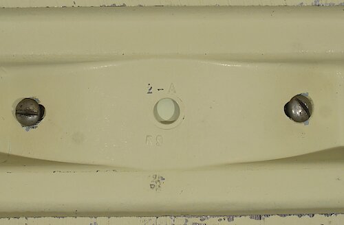 4 Same as type 3 but has a hole in the center of the base. Base is standard depth of 1 27/32 inches. The cavity number "1-A" or "2-A" has narrow spacing. The "69" at the bottom is right-aligned with the "1-A" or left-aligned with the "2-A". Used from ca. mid-1936 through the end of Style 4.. Big 4 Base 4 "2-A"