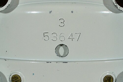 Metal 1 Metal base with number "53647" and a single digit cavity number. Thin numbers. I need more data to find how long it was used. This base came first.. Metal Base 1 "3"