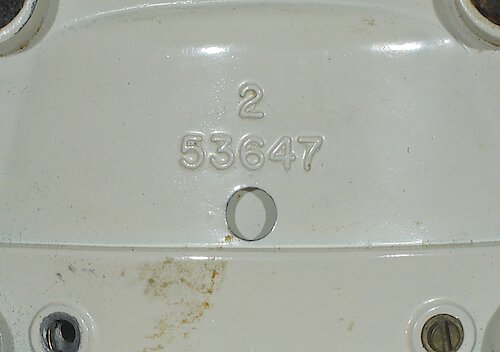 Metal 2 Metal base with number "53647" and a single digit cavity number. Thick numbers. This base came second. I need more data to determine when they started using this base. Used up through ca. 1970.. Metal Base 2 "2"