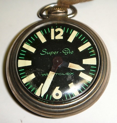 Westclox Super Glo Pocket Watch. Dial Notice the large luminous hands and hour markers.

The dial says: 

Super-Glo

Westclox

Made in Canada at bottom of dial.

Photo used by permission of Richard Frison.