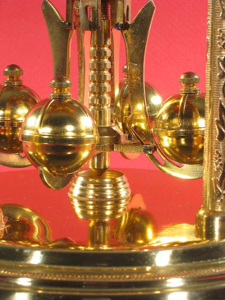 Schatz Standard 400 Day Gufa Style Plates Finials Pendulum. Note the ridges on the tops of the pendulum balls. Most pendulum balls are smooth.