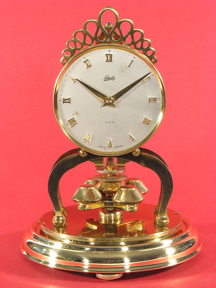 Schatz Miniature 400 Day Round Plastic Dome. Schatz miniature 400 day clock dated 5 56 (May 1956) on the movement.