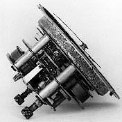 Westclox Baby Ben 2 Inch. Side view of the "two layer" movement used in the Baby Ben Two Inch. The layer nearest the dial is the timekeeping portion and is the 2 inch time-only movement commonly used in novelty and desk clocks. The rear layer of the movement contains the alarm mechanism.