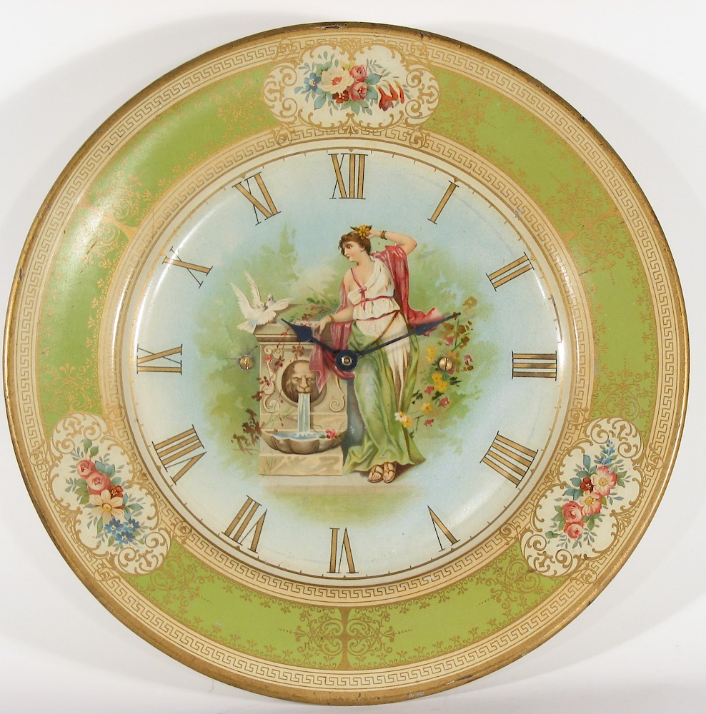 Westclox Plate Time. This painted metal plate clock is 10 1/8 inches diameter. The movement is dated 9-9-06 (September 9, 1906) and was made by Western Clock Manfacturing Company, LaSalle, Illiinois, USA. The movement cover has the patent date October 28, 1902. The rear of the plate is labeled "(Patent Applied For)"