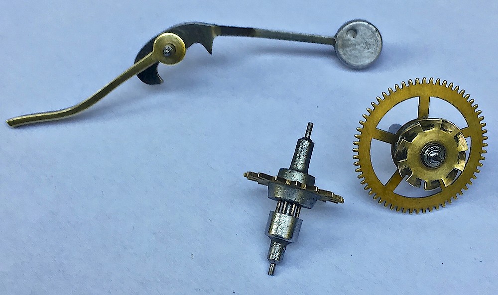 Westclox Alternating Alarm. Alarm hammer with brass tail, alarm escape wheel, third wheel with fan shaped repeat cam.