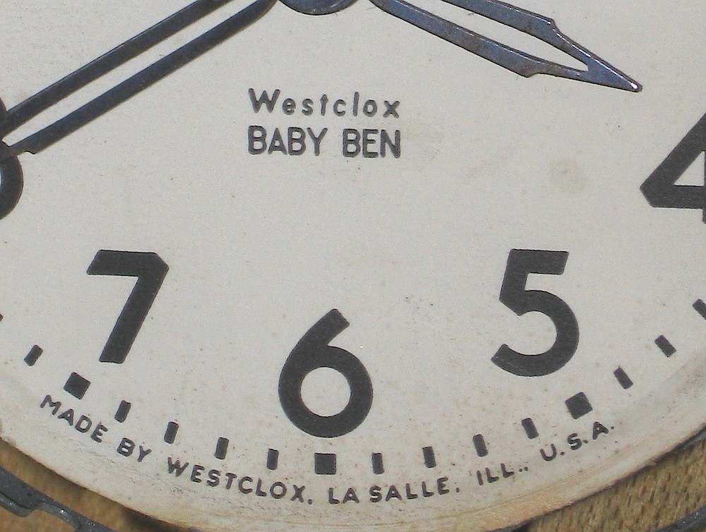 Westclox Baby Ben Style 4 Ivory Plain. Dial "MADE BY WESTCLOX" with "Westclox" and "BABY BEN" the same width.