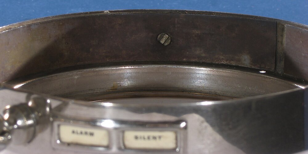 Westclox Big Ben Style 1 Nickel. Bezel showing leg riveting