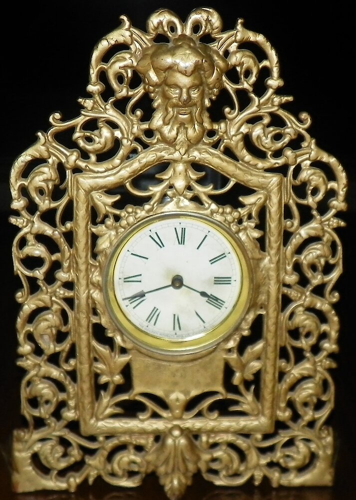 Bacchus Scrollwork Cast Front. Bacchus Scrollwork Cast Front Clock Example Photo