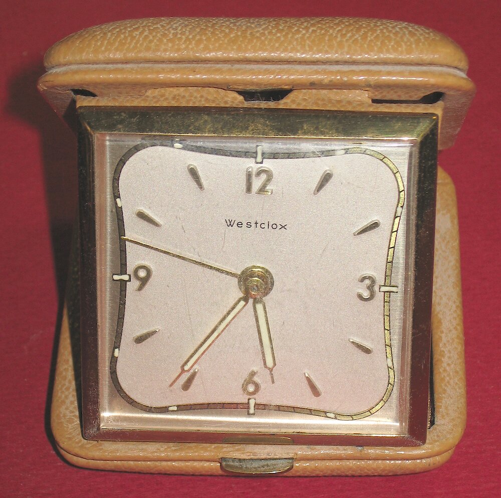 Westclox Travette Tan. Travette No. 455 Travette No. 455. Travel alarm clock in tan case. This is the 1957 Travette. Tan leather case 2 3/4 x 3 1/8 inches. Runs but stops. Alarm mainspring is broken. Model no. 455.