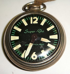 Westclox Super Glo Pocket Watch. Dial. Notice the large luminous hands and hour markers.

The dial says: 

Super-Glo

Westclox

Made in Canada at bottom of dial.

Photo used by permission of Richard Frison.