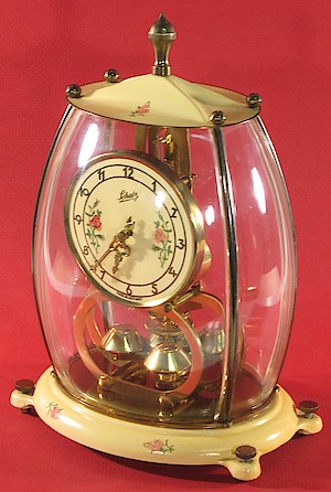 Schatz Miniature 400 Day Mademoiselle. Schatz Mademoiselle 400 day clock. The outside of the base is plastic. Plastic panels in cover.