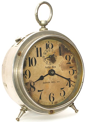 Westclox Baby Ben Style 1 Dealer Imprint Dial. "BAILER MFG. CO." This clock is dated 1-29-14 (January 29, 1914) on the movement.

This dial is paper (not celluloid covered) yet it has the type of numeral 4 seen on the celluloid covered dials.
