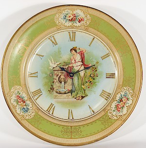 Westclox Plate Time. This painted metal plate clock is 10 1/8 inches diameter. The movement is dated 9-9-06 (September 9, 1906) and was made by Western Clock Manfacturing Company, LaSalle, Illiinois, USA. The movement cover has the patent date October 28, 1902. The rear of the plate is labeled "(Patent Applied For)"