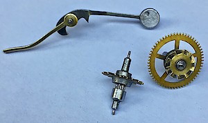 Westclox Alternating Alarm. Alarm hammer with brass tail, alarm escape wheel, third wheel with fan shaped repeat cam.
