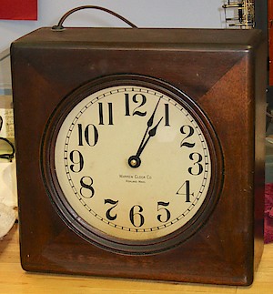 Telechron 101. Warren Clock Co., auxiliary movement. Mahogany case. This clock may have originally had a "Type A" motor, as the motor mounting posts will fit a Type A, and the label has no patents on it, just like those seen on a similar clock with the Type A motor.