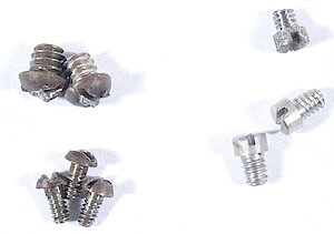 Westclox Big Ben Style 1 Nickel. Screws: Back (top left), trip spring (top right), bezel (bottom left) and balance.