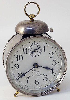 Westclox Monitor Style 2 Nickel. "Day's Guaranteed Alarm" on dial. Has spade minute hand.