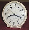 Has model sticker on back. Radial numerals.