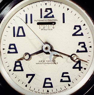 Close-up of dial of New Haven Westinghouse electric clock with automatic control