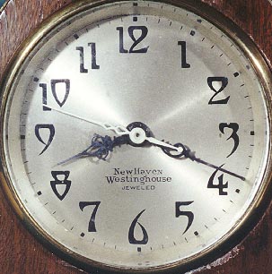 Dial of wood case New Haven Westinghouse electric clock with automatic control