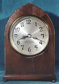 Wood case New Haven Westinghouse electric clock with automatic control