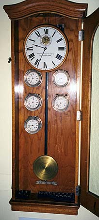 Circa 1925 master clock with pilot clocks and battery gauge