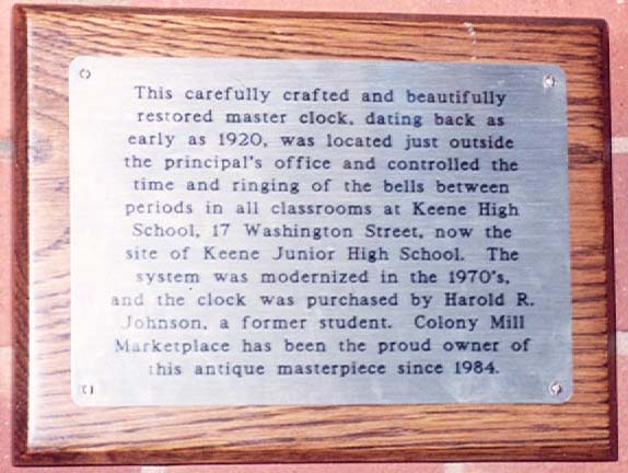 Closeup of plaque beneath mall clock