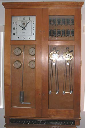 1950s master clock in double-width double-door case