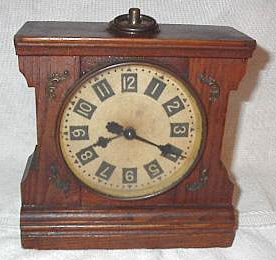 Unusual oak-cased alarm clock by Phelps and Bartholomew