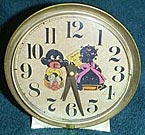 Fake clock with black children on potty, made from a Big Ben style 7