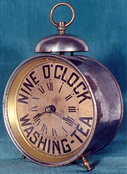 Angle view of Nine O'clock Washing Tea advertising clock. Made by Western Clock Mfg. Co. ca. 1895 - 1896